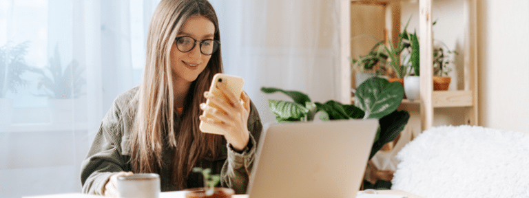 woman scanning SMS for B2B payment updates and reminders