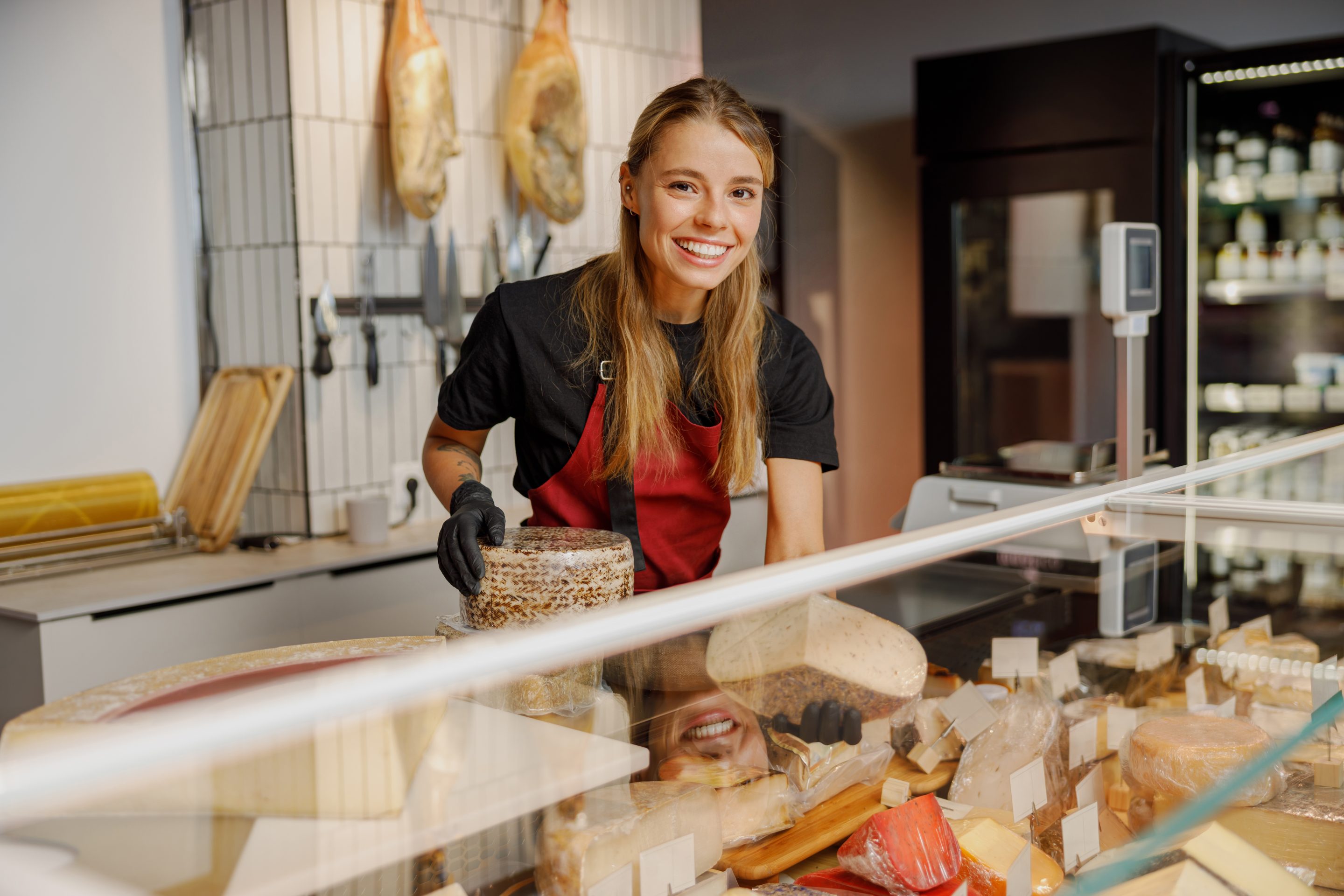 A female deli shop employee working in F&B industry